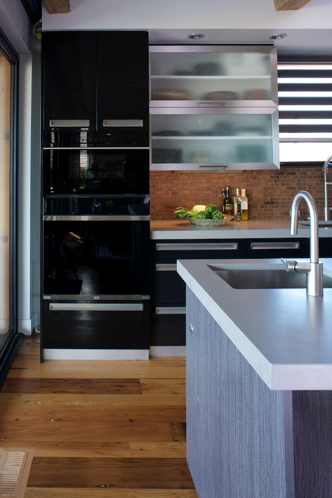 Dark tailored cabinetry in the Rustic Modern residence