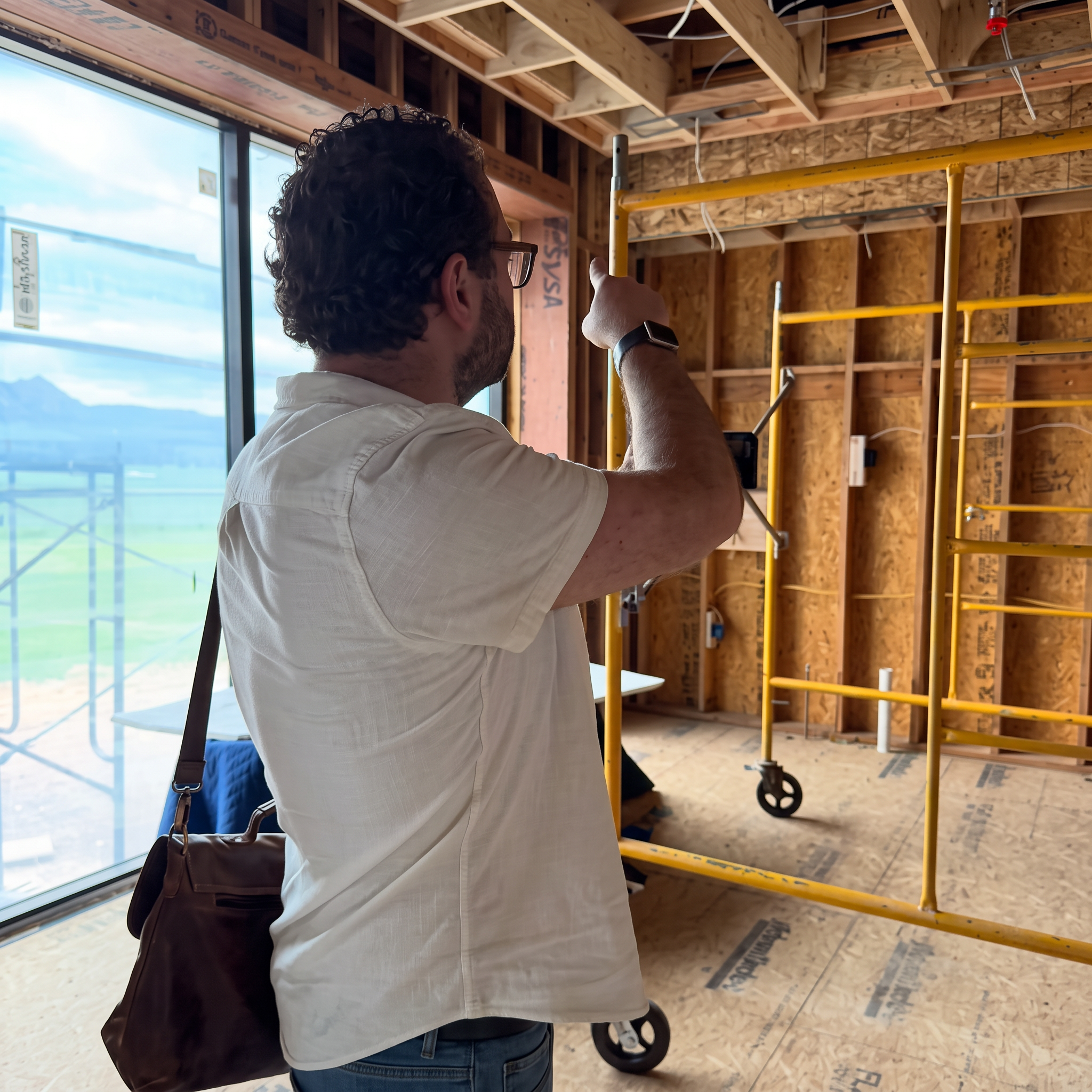Derek Haughey reviewing construction details during a site visit